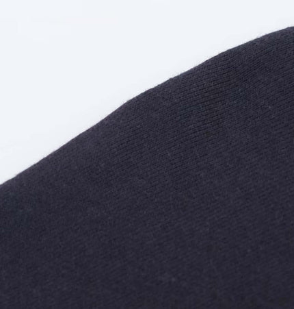 Close-up of the fabric texture of the Retro Printed Pullover Hoodie – Loose Fit in dark color.