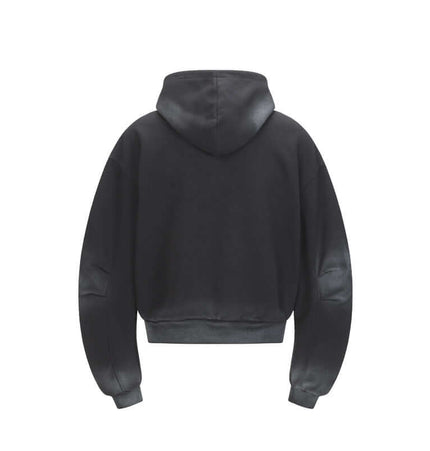 Back view of the Patchwork Half-Zip Hoodie showcasing its hood and cropped design in a solid color.