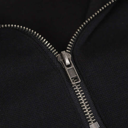 Close-up of the zipper on a Patchwork Half-Zip Hoodie, showcasing its high-quality metal detailing.