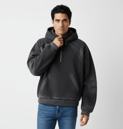 Model wearing a Patchwork Half-Zip Hoodie in dark color, showcasing a stylish half-zip design and relaxed fit.