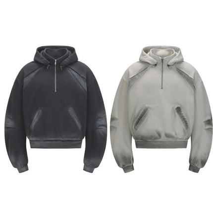 Patchwork Half-Zip Hoodie available in black and light grey, featuring a stylish half-zip design and urban patchwork style.
