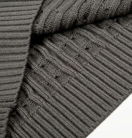 Close-up of a texture detail of a Retro Wool Sweater - Loose Fit showcasing the ribbed knit fabric and cozy design.