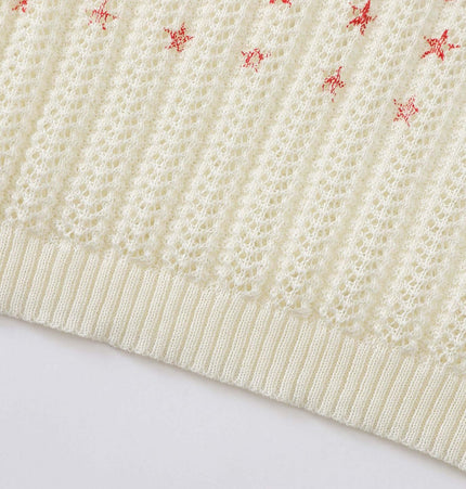 Round Neck Jacquard Knit Sweater close-up showing stitch detail and ribbed hem.