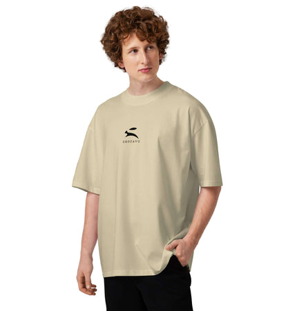 Model wearing the SATU020 High Neck Tee in beige, showcasing its oversized fit and modern street style.