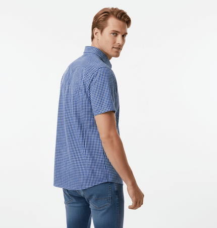 Man wearing a Short Sleeve Plaid Shirt, showcasing a blue plaid pattern from the back.