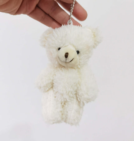 Shy Blush Bear Plush Keychain held in hand, featuring a cute stuffed bear with dense plush fur.