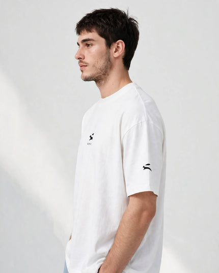 Side profile of the white wide collar tee, generous oversized fit