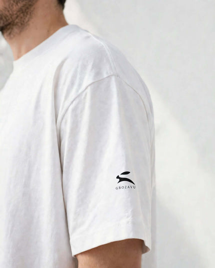 Macro of the sleeve logo on the White 237 g/m² Icons Box Tee