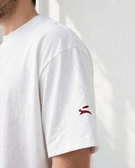Sleeve logo detail on the white 237 g/m² combed ring-spun cotton tee