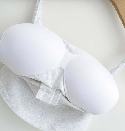 Lace Strap Button Tank Top - Slim Fit with lace straps and built-in chest cushion on a wooden hanger.