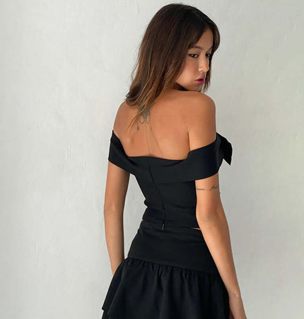 Slim Fit One-Shoulder Bow Top shown from the back, featuring a stylish bow accent and flattering silhouette.