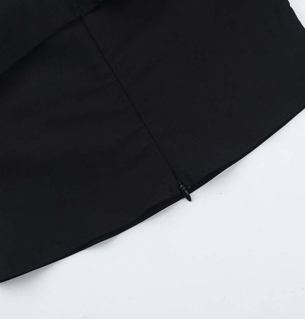 Close-up view of the Slim Fit One-Shoulder Bow Top showing the stylish bow detail and zip closure.