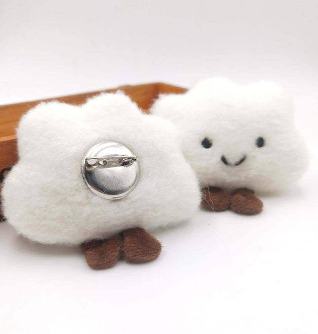 Smiley Cloud Plush Keychain shown with a smiling cloud design, featuring plush texture and a pin attachment.