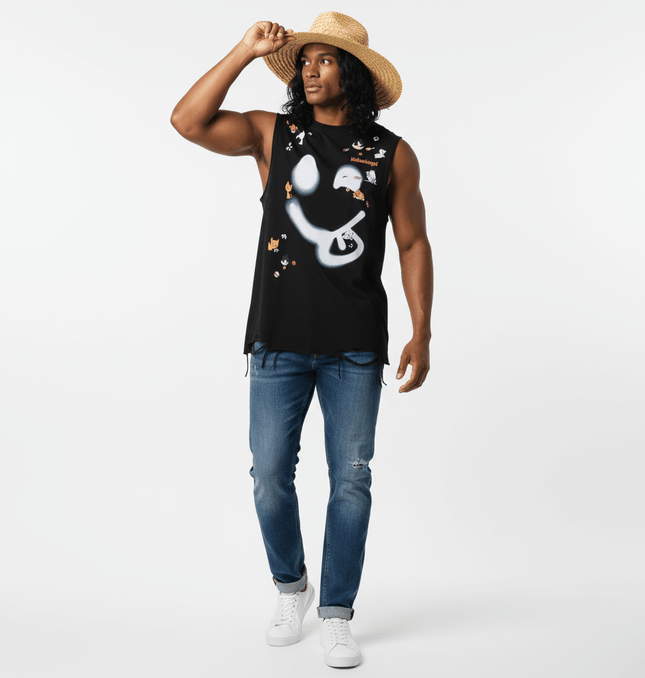 A model wearing a Smiley Graffiti Print Sleeveless Tank Top, styled with a straw hat and blue jeans.
