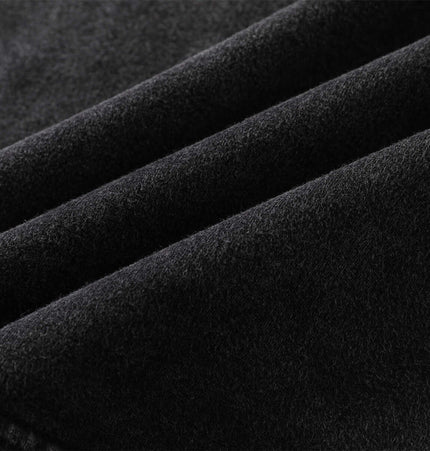 Close-up of soft black fabric showcasing the texture of the Washed Sleeveless Hooded Tank Top.