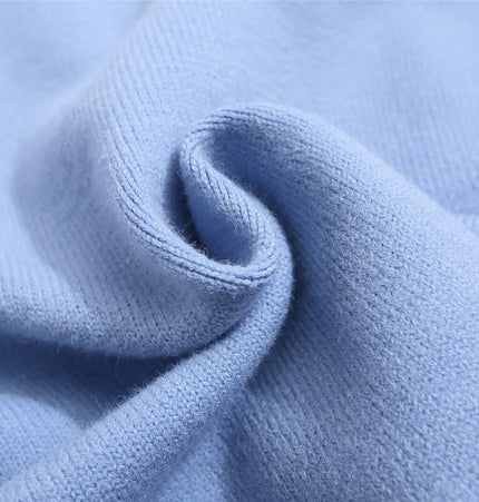 Close-up of soft blue fabric showcasing the texture of the Retro Cartoon Jacquard Hoodie - Loose Fit.