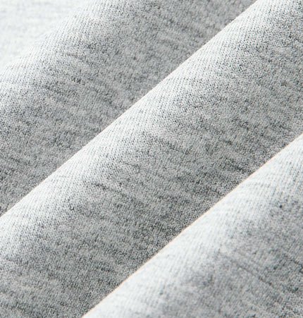 Close-up of soft fabric showcasing texture of Five-Button Henley TShirt – Loose Fit in gray color.