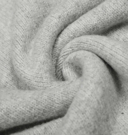 Close-up of soft polyester knit fabric of Loose Buttoned Turn Down Collar Sweater