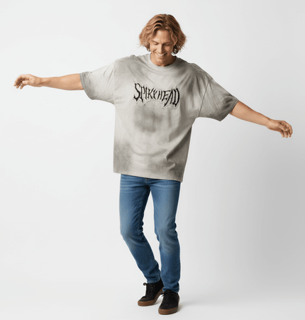 Patch Embroidery TShirt – Loose Fit worn by man in a relaxed stance, showcasing oversized design and casual street style.