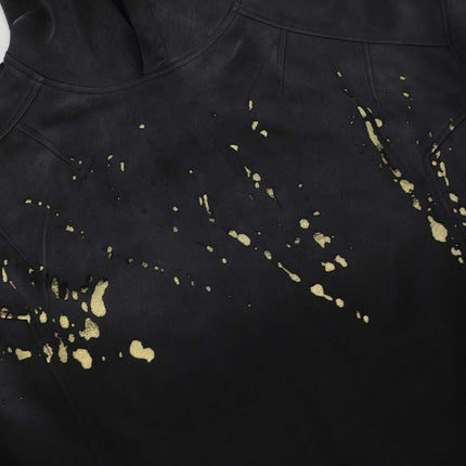 Splashing Ink Spliced Hooded Sweatshirt showcasing unique splashing ink design on a black background.