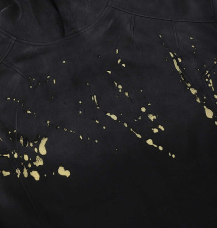 Splashing Ink Spliced Hooded Sweatshirt showcasing unique splashing ink design on a black background.