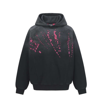 Splashing Ink Spliced Hooded Sweatshirt featuring a bold splattering ink design in pink on a black background.