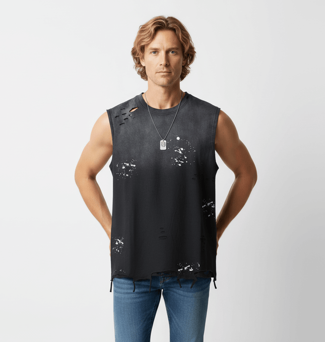 Man wearing a Splatter Ink Tank Top – Loose Fit with distressed details and a stylish, casual look.