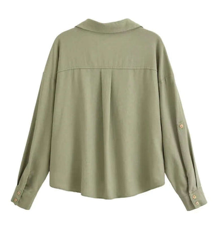Back view of the Spliced Green Shirt – Loose Fit, showcasing its stylish design and comfortable fit.
