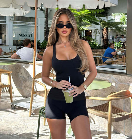 Square Collar Pleated Two-Piece Set worn by a woman in sunglasses holding a drink at an outdoor cafe.