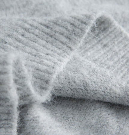 Close-up of soft fabric texture of Stand Collar Pullover Sweater - Loose Fit in light gray color.