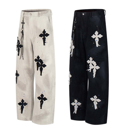 Straight Leg Patchwork Denim Jeans featuring cross patch embroidery and color splatter detailing.