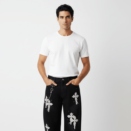 Straight Leg Patchwork Denim Jeans worn by a model with a white t-shirt, showcasing bold embroidery and artistic design.