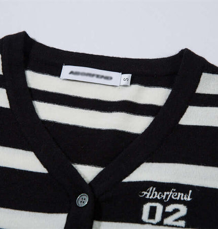 Striped VNeck Knit Cardigan – Slim Fit featuring classic black and white stripes and V-neckline.