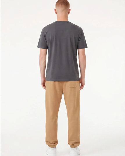 Detail shot of the Maison Grozavu Archival Umber Trousers in supreme — showing the premium fabric texture.