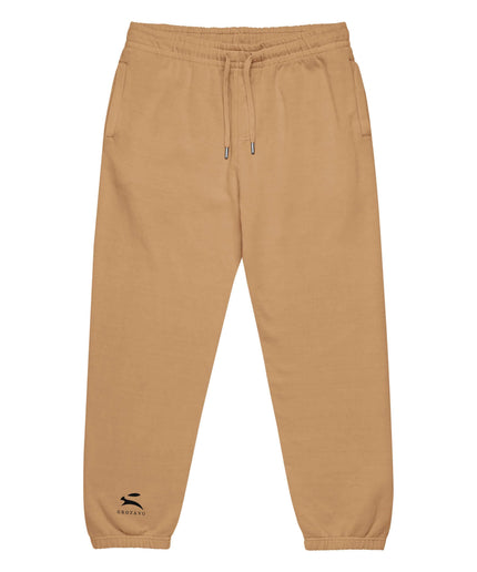Detail shot of the Maison Grozavu Archival Umber Trousers in supreme — showing the tailored hem.