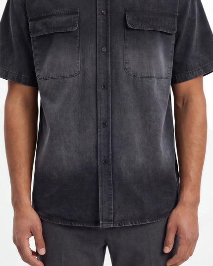 Detail shot of the Maison Grozavu Earth Shirt Mark in style — showing the structural collar.
