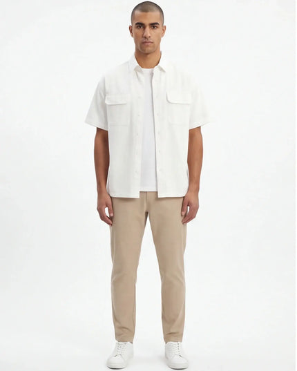 Lifestyle shot of the Maison Grozavu Earth Shirt Mark in style — showing the sophisticated hardware.