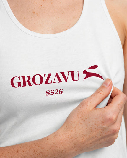 Side seam and hem detail on the white cotton tank top