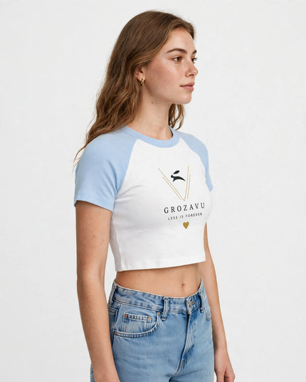 Three-quarter view of the baby blue micro rib raglan baby tee