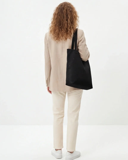 Maison Grozavu Alabaster Bag Structure — rear view showing the back panel construction and neutral colourway hemline detail