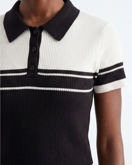 Minimalist Dune Polo — three-quarter view showing the silhouette from the front-left angle in neutral