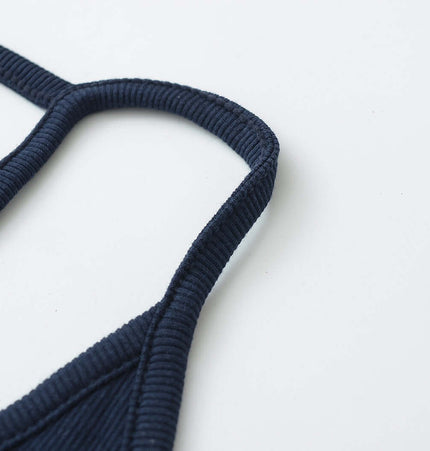 Detail of the UNeck Crop Tank Top – Slim Fit, showcasing the stylish straps and fabric texture.