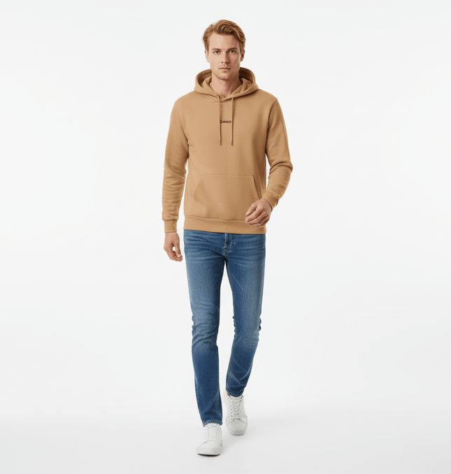 Urban Garment Dyed Hoodie – Loose Fit shown on a model walking, paired with jeans and sneakers.