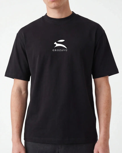 Front view of the Maison Grozavu Pure Carbon Tee in shirt — showing the tailored hem.