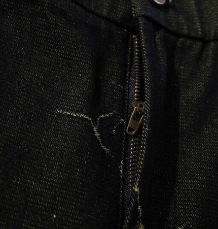 Close-up of the zipper detail on Lightning Cargo Wide Leg Denim Pants, showcasing durable denim fabric and unique design.