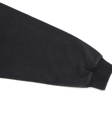 Washed Stand Collar Zipper Hoodie sleeve detail showcasing a washed black finish and ribbed cuff.