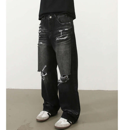 Washed Distressed Straight Jeans – Loose Fit showcased on model with a vintage worn look and wide-leg silhouette.