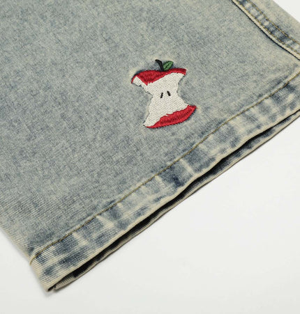 Washed Straight Cropped Jeans with playful apple core embroidery detail on cuff, showcasing trendy light blue wash.