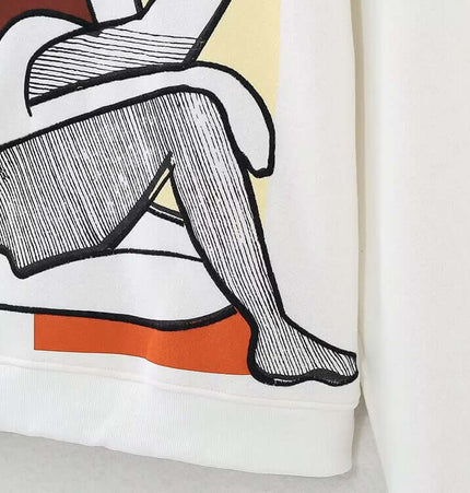 Embroidered Pattern Hoodie – Loose Fit showcasing artistic design with a white background and stylish illustrated detail.