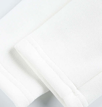 Detailed view of the cuffs of a Stand Collar Short Down Jacket in white fabric.